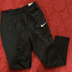 Black Nike pants. Tapered leg